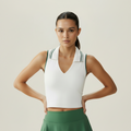 White V-neck crop top with green trim - close-up
